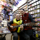 Kazuhiko Kobayashi, 80, and his wife Mieko Kobayashi, 73, at their Tokyo music shop (named Ameyoko Rhythm) which specializes in Enka, a traditional Japanese ballad.